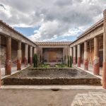 A colonnaded courtyard with painted walls in Pompeii